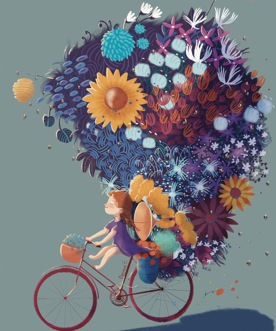 Flicka med blommor på cykel